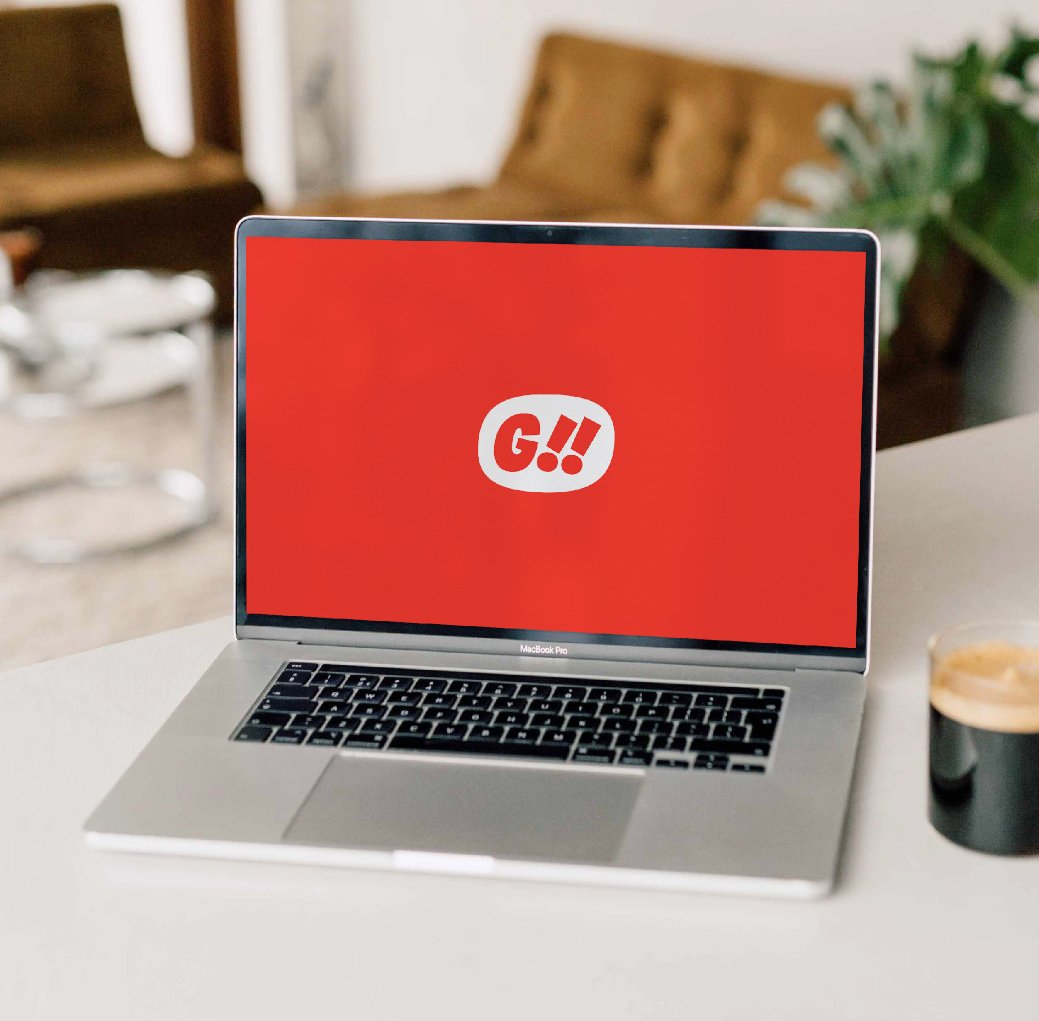 GYSHIDO G!! white badge logo displayed on red laptop screen in modern workspace mockup