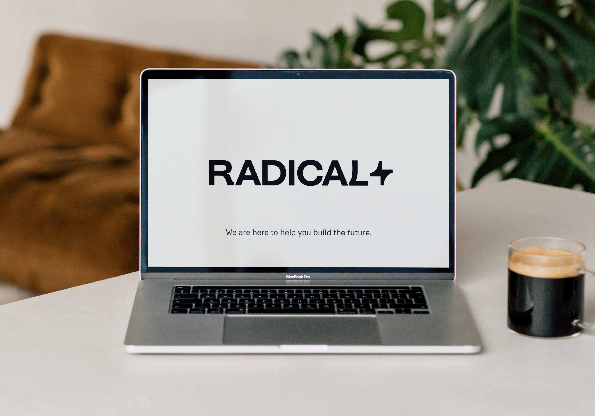 RADICAL logotype and tagline “We are here to help you build the future” on laptop screen